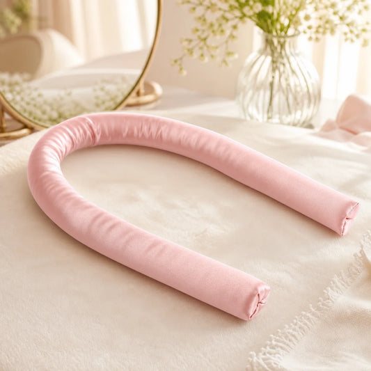 PIMOVO blush pink heatless curling band on a bright bedroom vanity