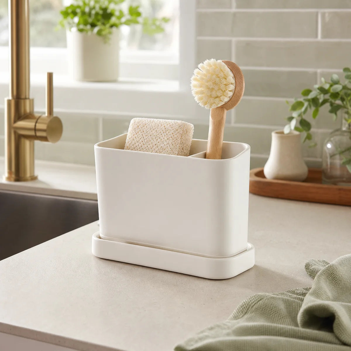 PIMOVO sink organizer caddy on a bright modern kitchen counter